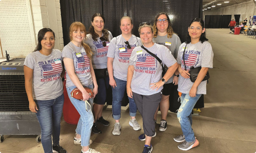 TriWest employees volunteering at an event